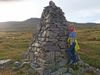 Kristín Steinsdóttir next to the memorial for Dísa, the famous ghost of Seyðisfjörður.