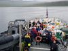 Volunteers and the crew of the Icelandic Coast Guard ship, leaving Barðsvík.