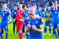 Sigurstemmning Aron Einar Gunnarsson fer fyrir fögnuði íslensku leikmannanna í leikslok á Laugardalsvellinum í gærkvöld.