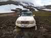 The two vehicles, after getting stuck off road.