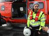 Ásgeir Trausti with the bottle, getting ready to board the helicopter.